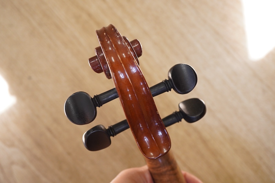 A cased students violin